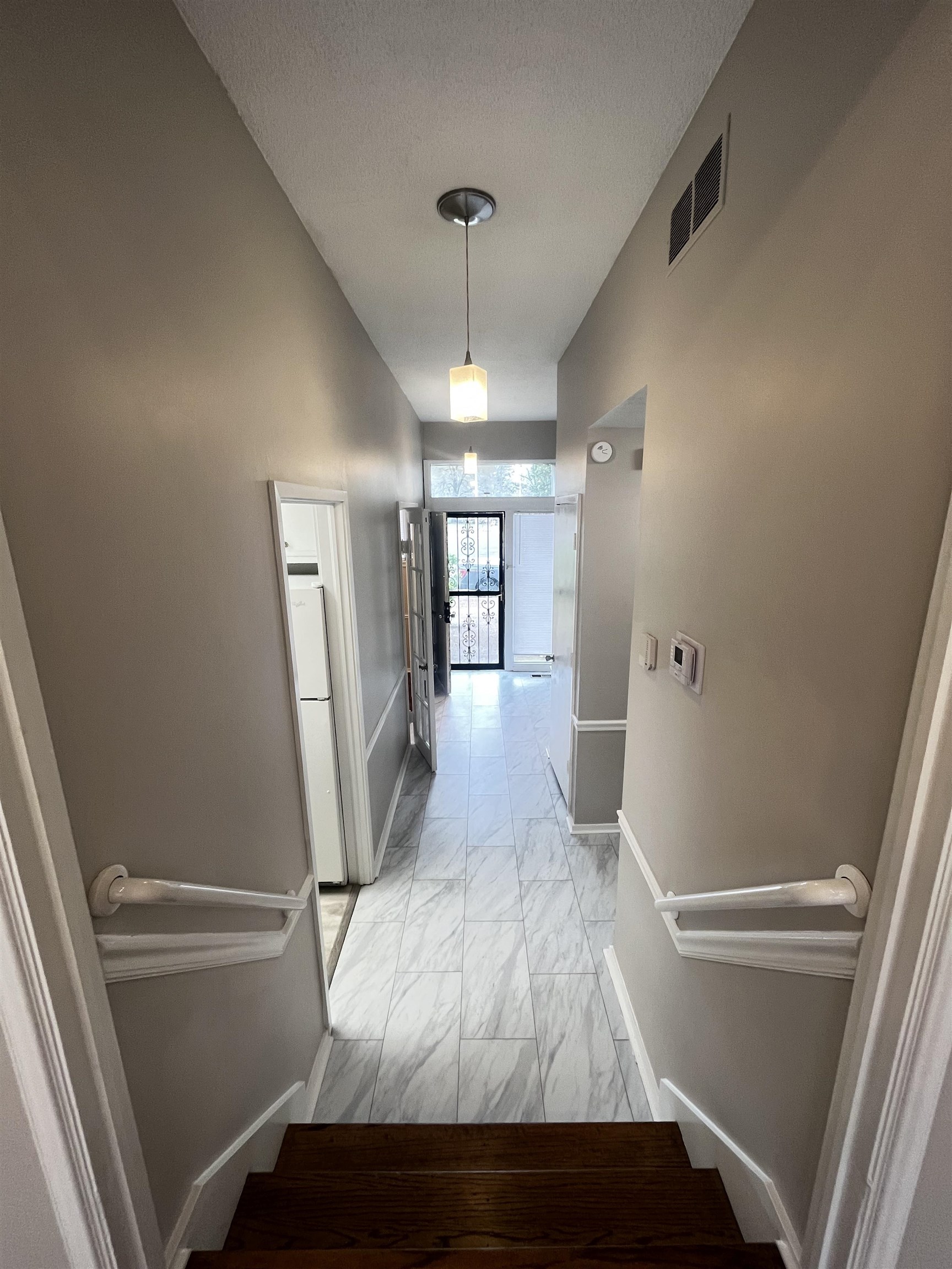 5763 Barfield Road, Unit 5763 Memphis, TN 38120 - Photo 4 of 21 a view of a hallway view with wooden floor and staircase