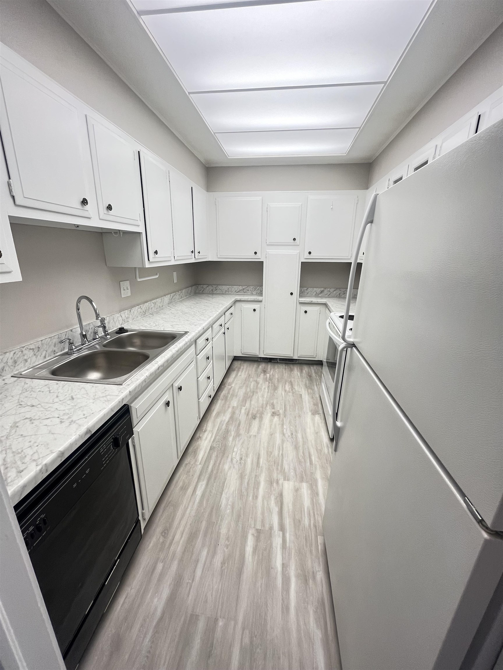5763 Barfield Road, Unit 5763 Memphis, TN 38120 - Photo 8 of 21 a kitchen with a sink a stove and cabinets