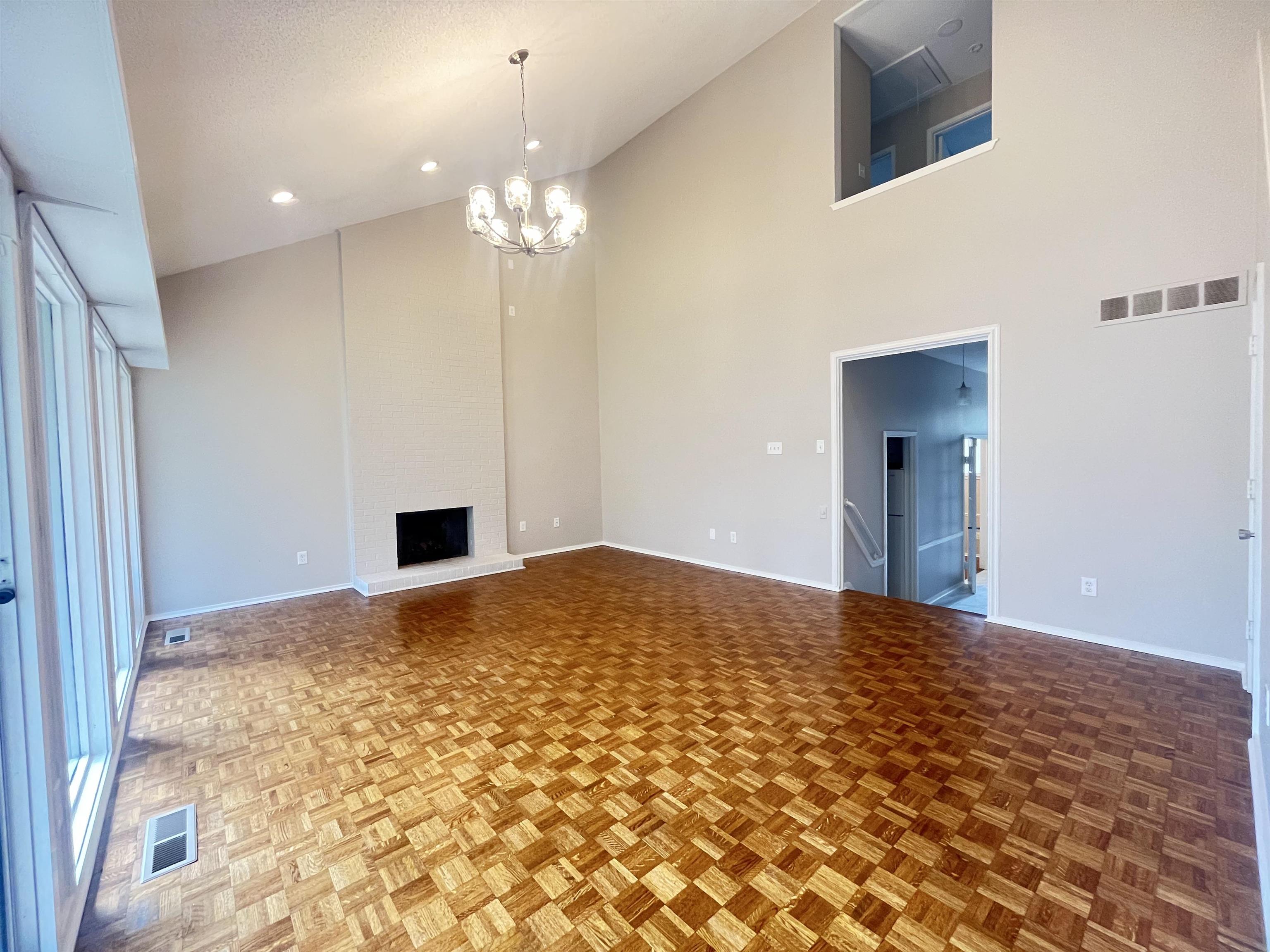 5763 Barfield Road, Unit 5763 Memphis, TN 38120 - Photo 10 of 21 a view of a bedroom with a bed and a chandelier