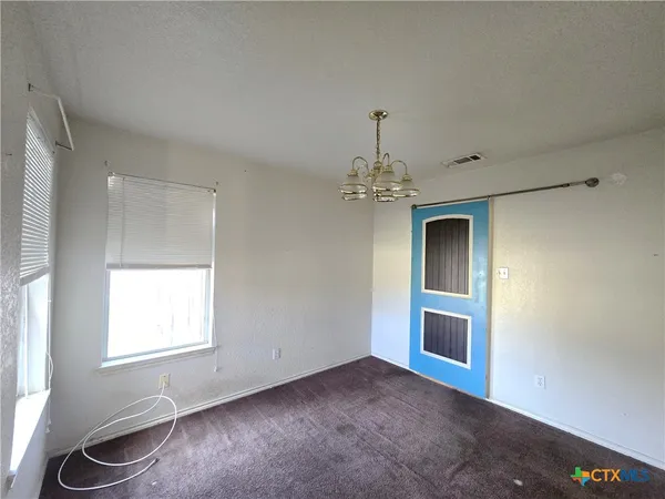 a view of a livingroom with a chandelier