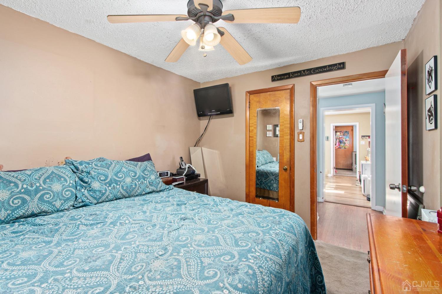 40 Emmans Road Ledgewood, NJ 07852 - Photo 13 of 24 a bedroom with a large bed and a chandelier