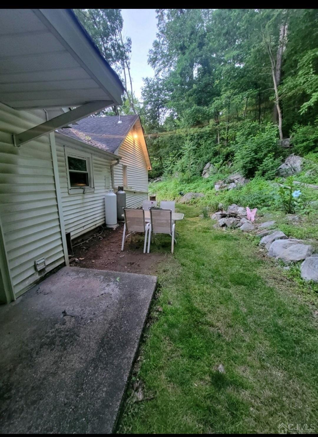40 Emmans Road Ledgewood, NJ 07852 - Photo 22 of 24 a view of a chairs and table in backyard