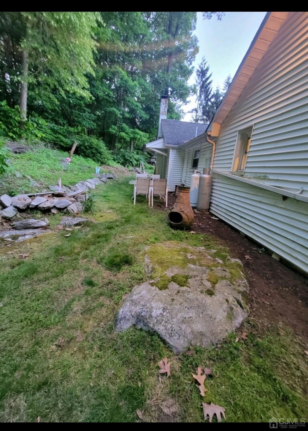 40 Emmans Road Ledgewood, NJ 07852 - Photo 23 of 24 a view of a house with a yard porch and sitting area