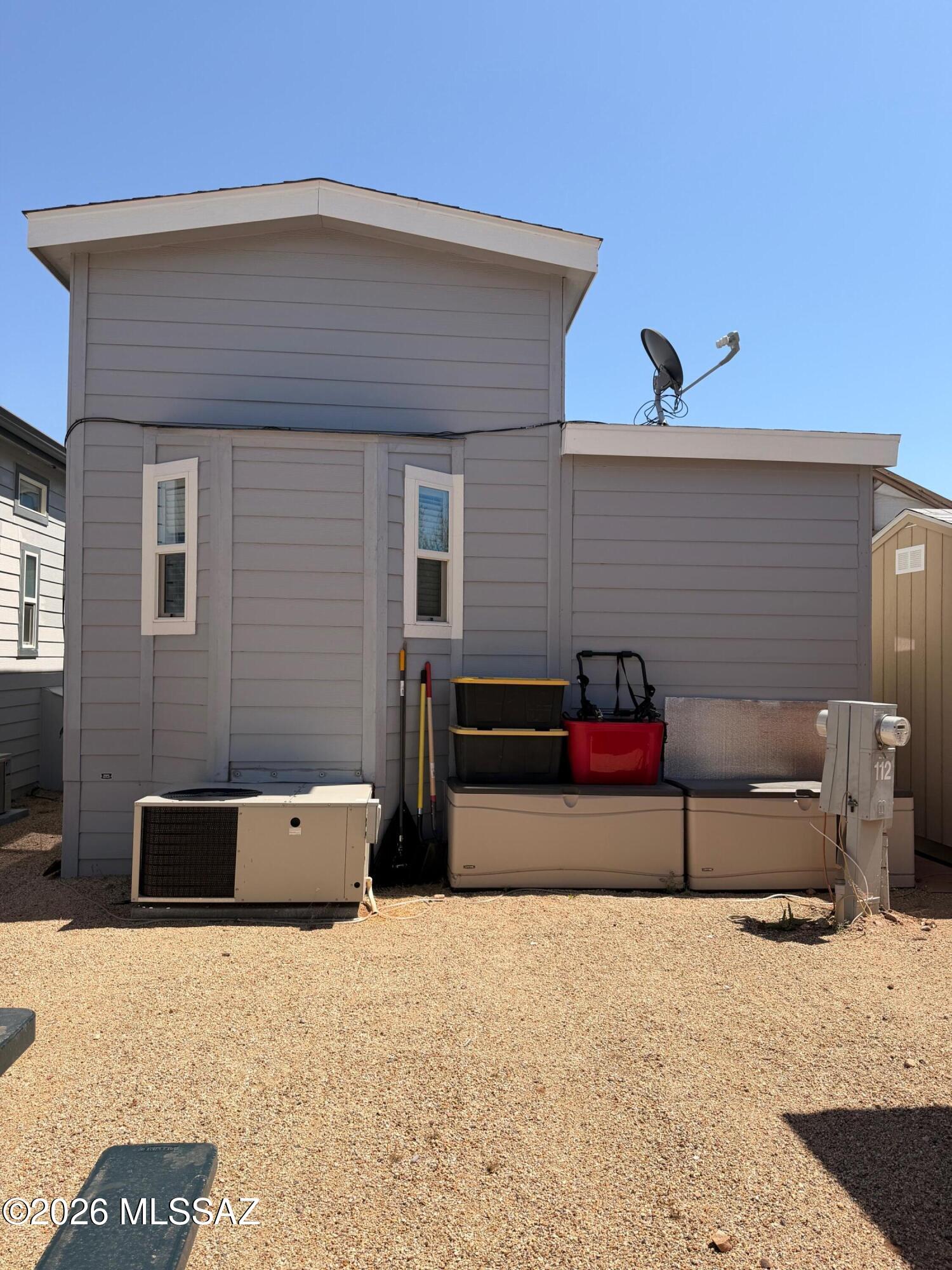 2843 19 Interstate 19 Frontage Road, Unit 116 Amado, AZ 85645 - Photo 29 of 32 a backyard of a house with furniture