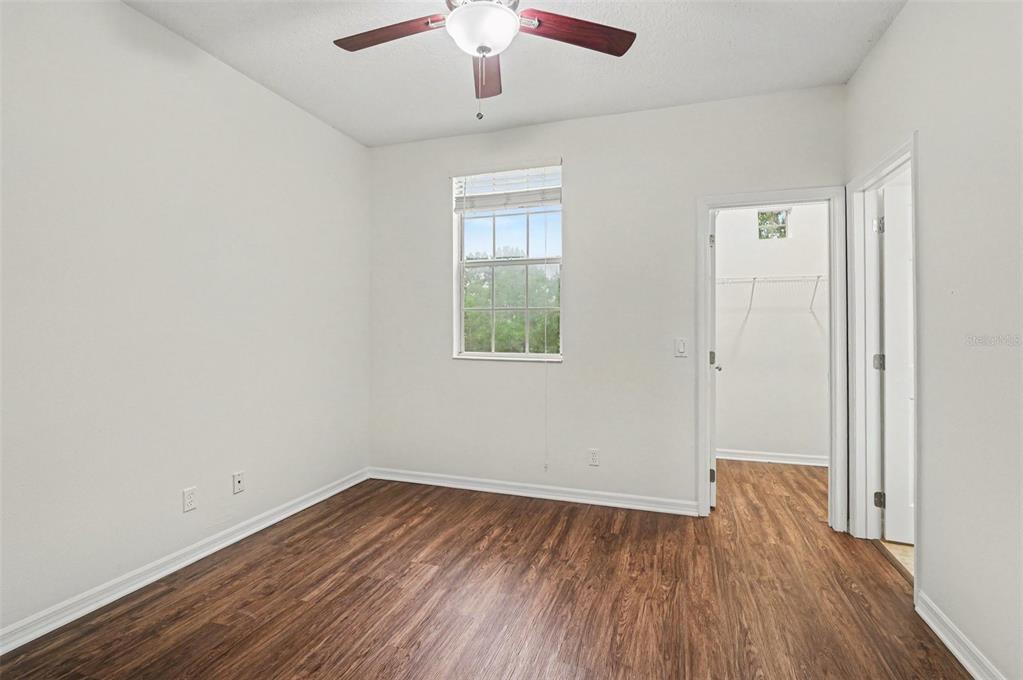 4819 Indian Deer Road Windermere, FL 34786 - Photo 20 of 30 wooden floor in an empty room with a window