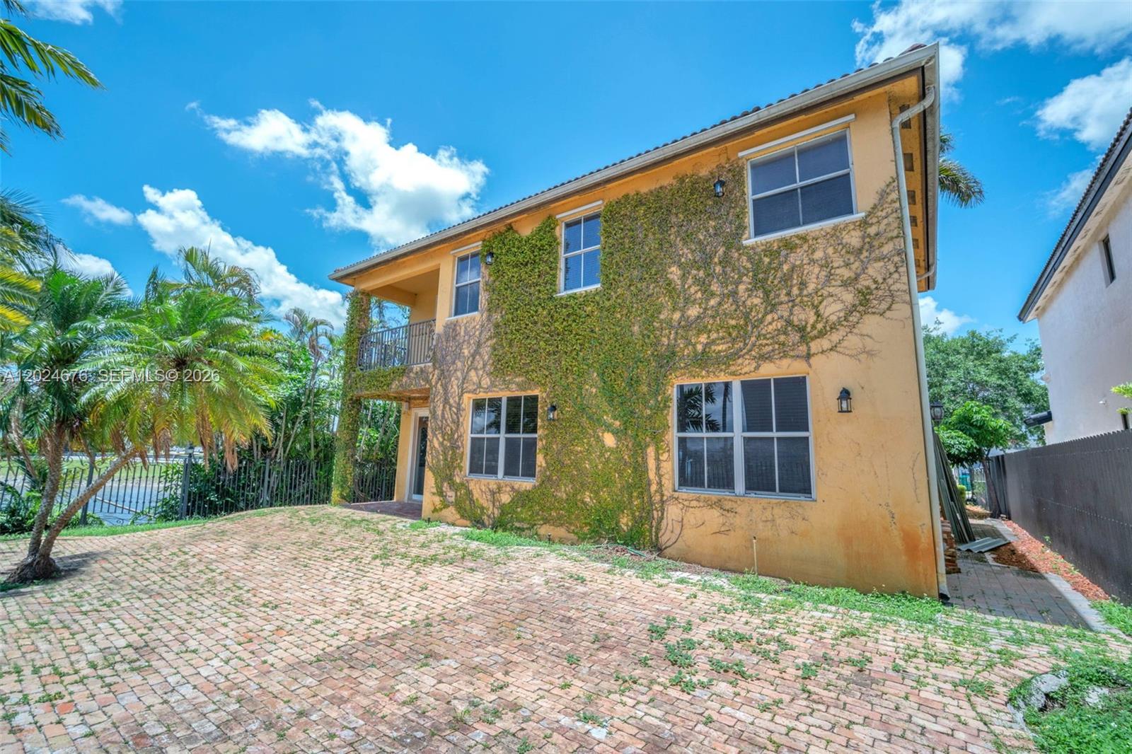 2155 Southwest 156th Court Miami, FL 33185 - Photo 53 of 57 a front view of a house with a yard and garage