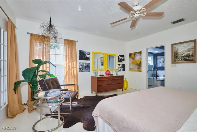 a bedroom with a bed and furniture