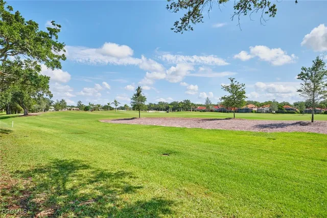 a view of a golf course with a lake