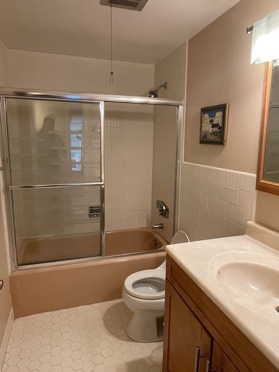 22 Chestnut Place, Unit 316 Brookline, MA 02445 - Photo 15 of 19 a bathroom with a sink a toilet and shower