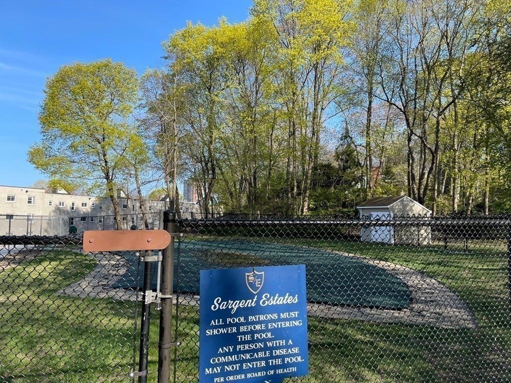 22 Chestnut Place, Unit 316 Brookline, MA 02445 - Photo 17 of 19 a view of a table and chairs in the garden