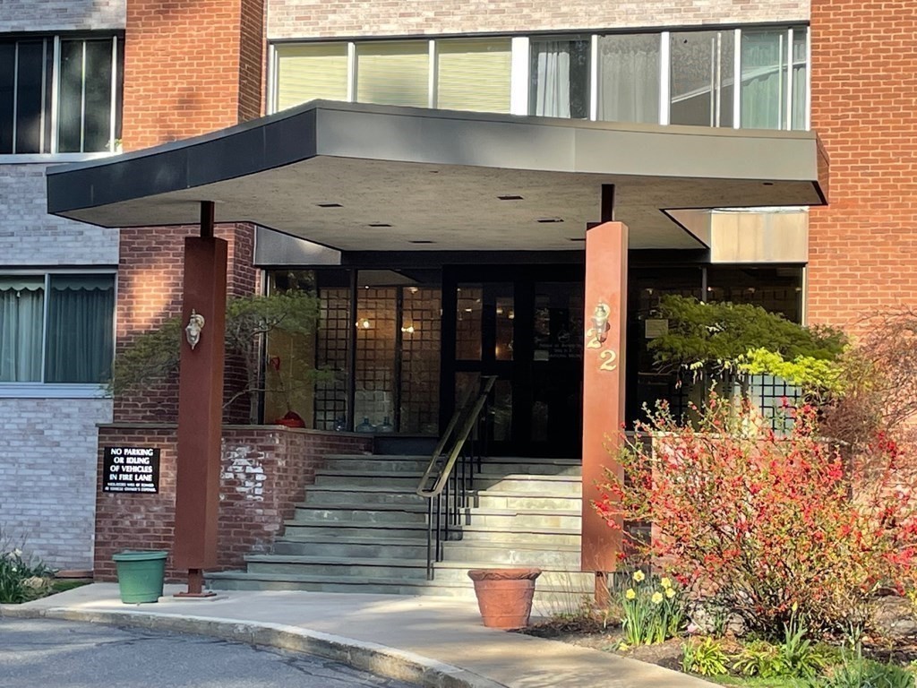 22 Chestnut Place, Unit 316 Brookline, MA 02445 - Photo 2 of 19 a front view of a building with street view