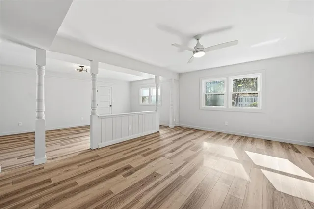 wooden floor in an empty room with a window
