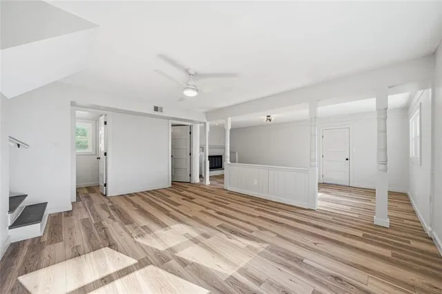 a view of a livingroom with wooden floor