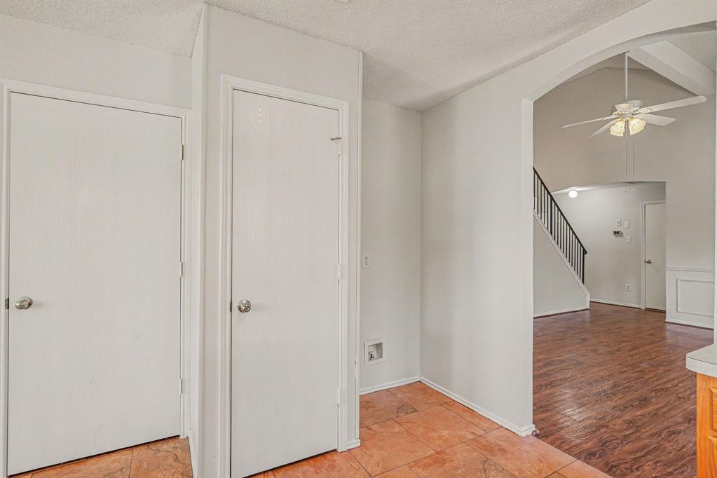2541 Rivers Edge Drive Fort Worth, TX 76118 - Photo 11 of 31 a view of a hallway with wooden floor and staircase