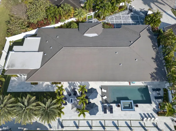 a view of swimming pool with outdoor seating and city view