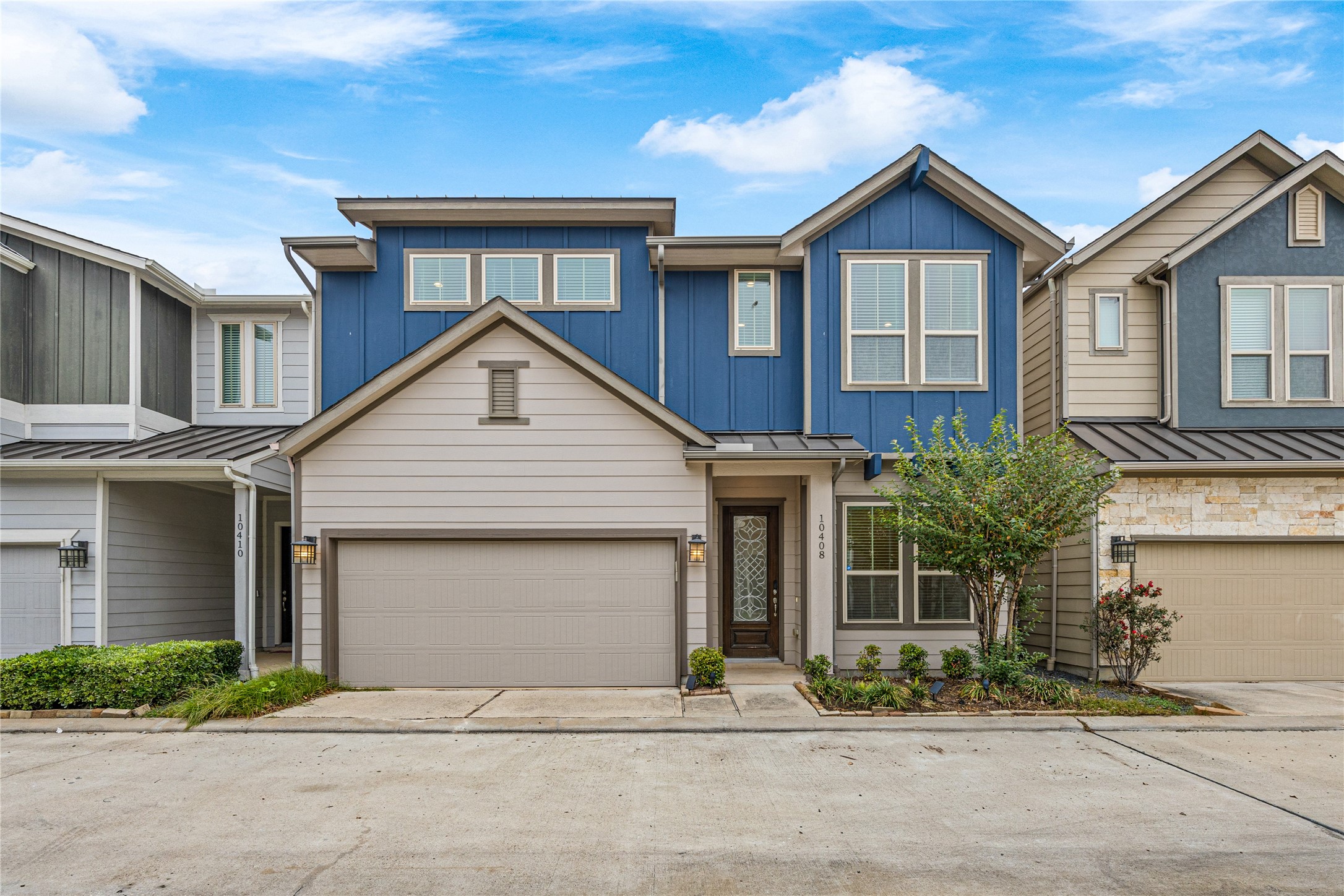 Front exterior of this beautiful two-story residence with contemporary design, situated within a gated community in Spring Branch.