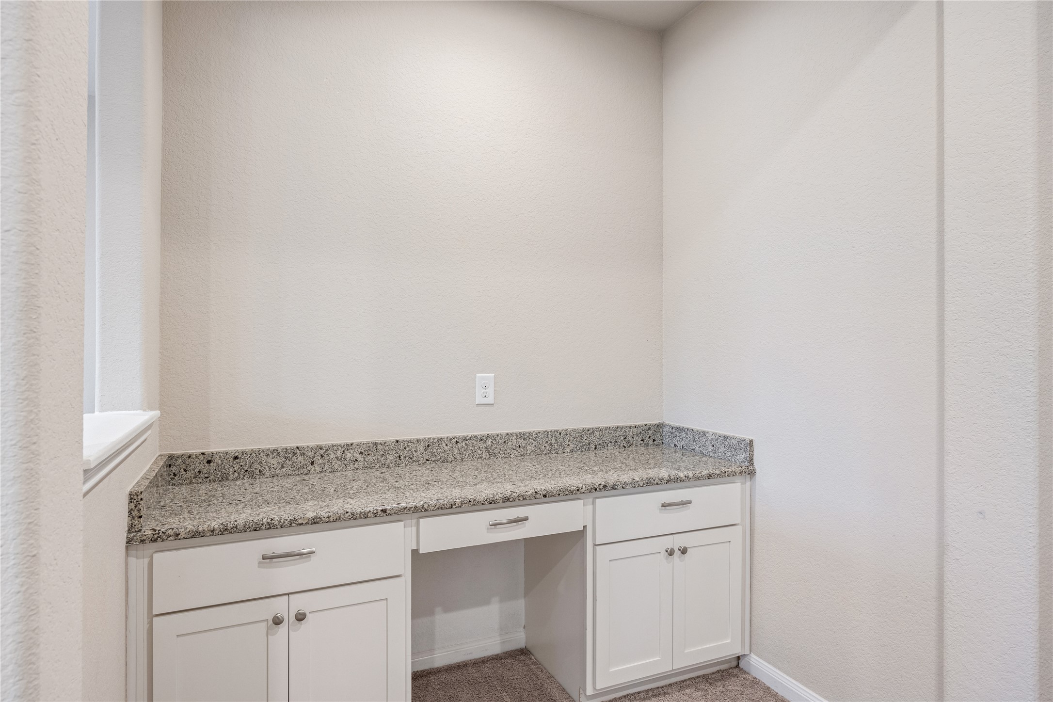10408 Quiet Courtyard Road Houston, TX 77043 - Photo 22 of 24 Upstairs built-in desk providing a dedicated workspace, ideal for work or study.