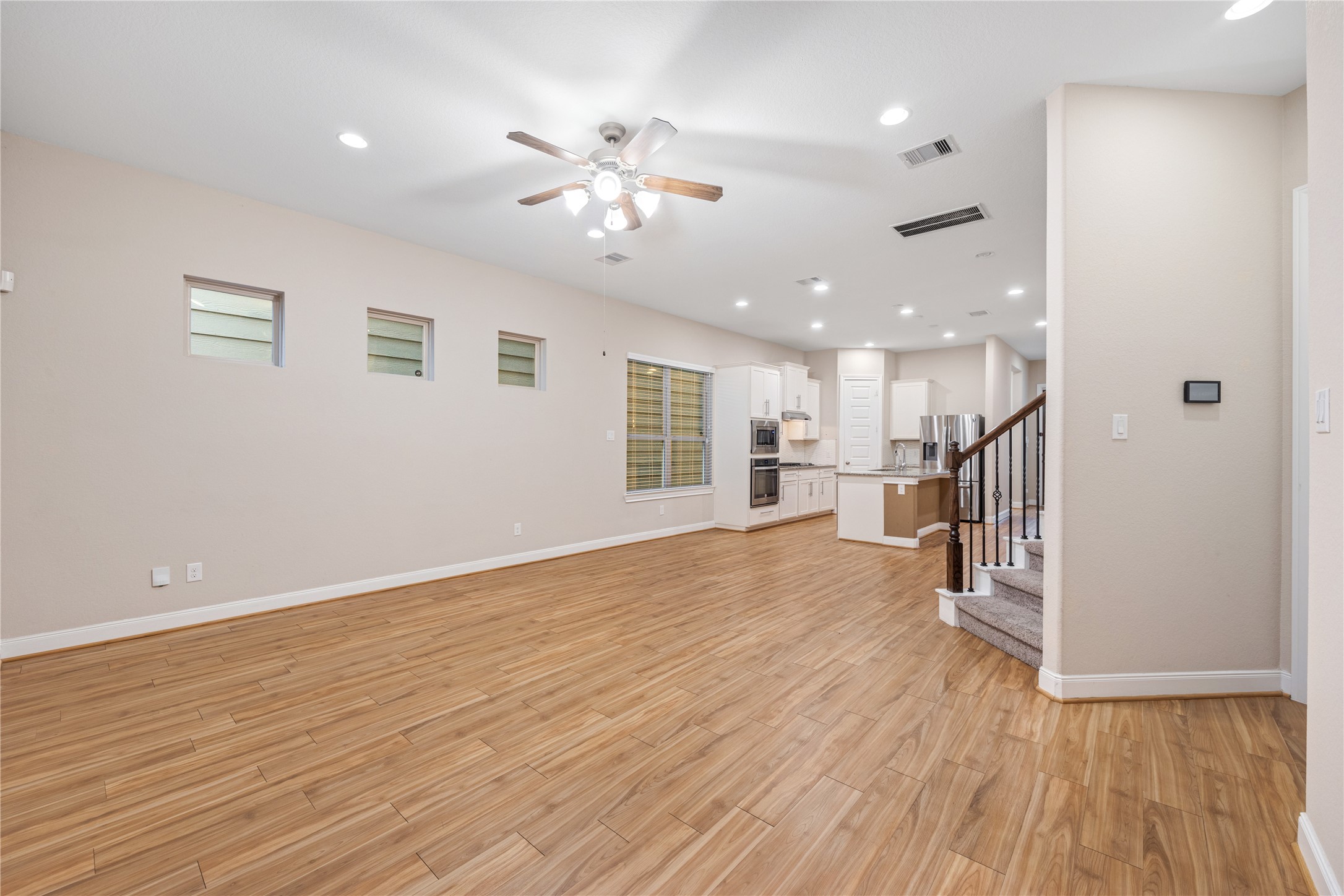 10408 Quiet Courtyard Road Houston, TX 77043 - Photo 9 of 24 Spacious living room with an open layout and natural light.