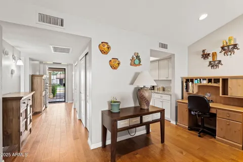 a view of a workspace with furniture and toys