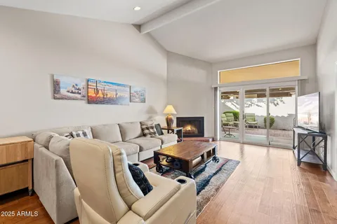 a bedroom with furniture and a large window