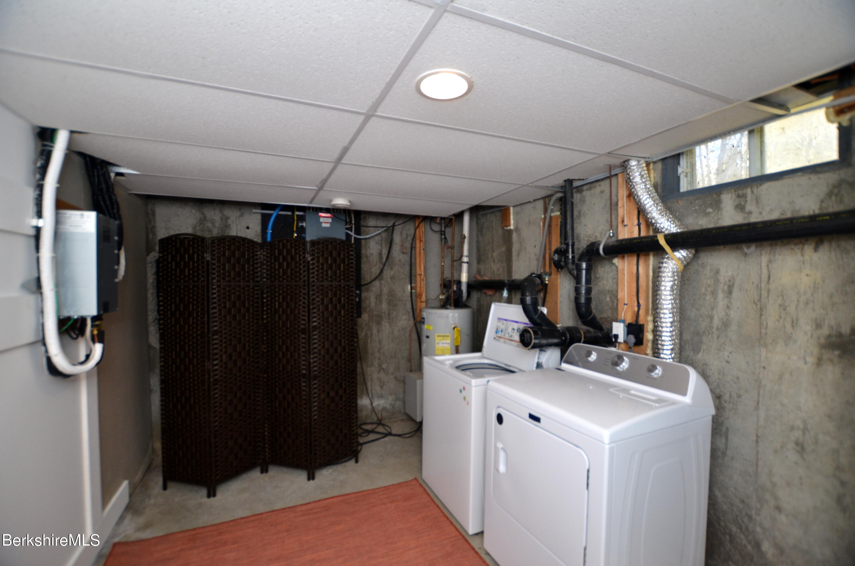 95 Middlefield Road Peru, MA 01235 - Photo 33 of 39 a view of a closet with storage
