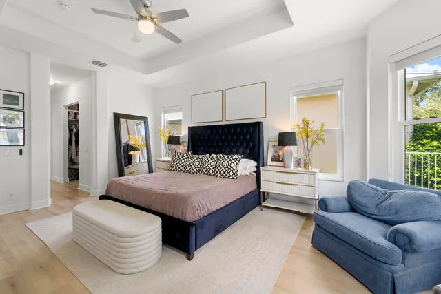 a spacious bathroom with a double vanity sink mirror and bathtub