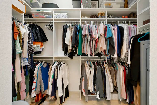 a living room with furniture a large window and a flat screen tv