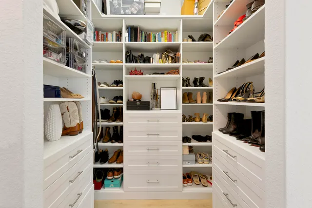 a swimming pool with lots of tress in front of it