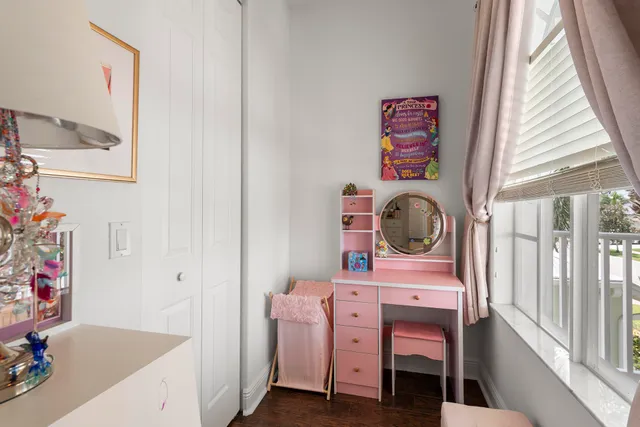 a view of a livingroom with workspace and a window