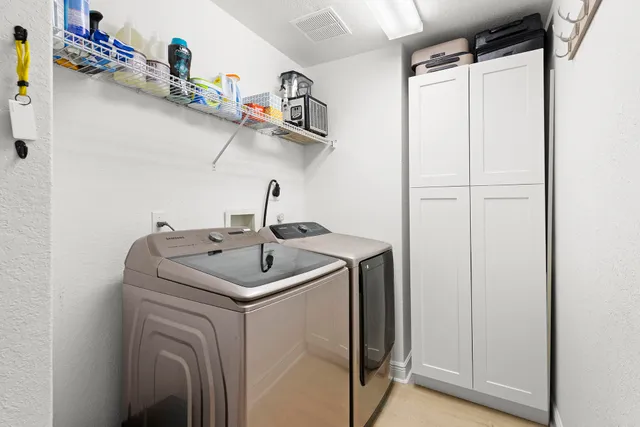 a view of swimming pool with outdoor seating and palm tree