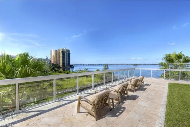 a view of a balcony with lake view and mountain view