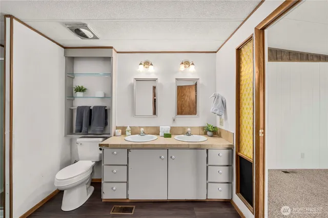 a view of closet with wooden floor