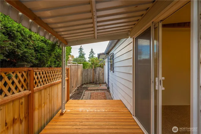 a view of house and wooden fence