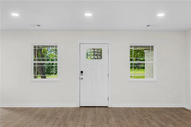 an empty room with windows