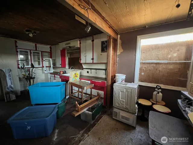 a room with furniture and a window