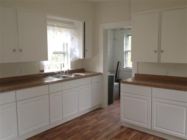 382 Boston Road Billerica, MA 01821 - Photo 3 of 17 a kitchen with granite countertop white cabinets and sink