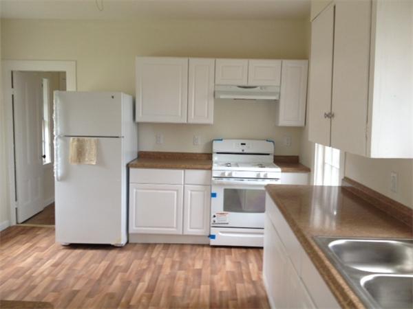 382 Boston Road Billerica, MA 01821 - Photo 4 of 17 a kitchen with a sink a stove and refrigerator