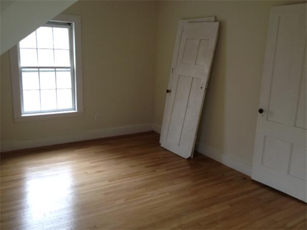 382 Boston Road Billerica, MA 01821 - Photo 6 of 17 an empty room with wooden floor and windows
