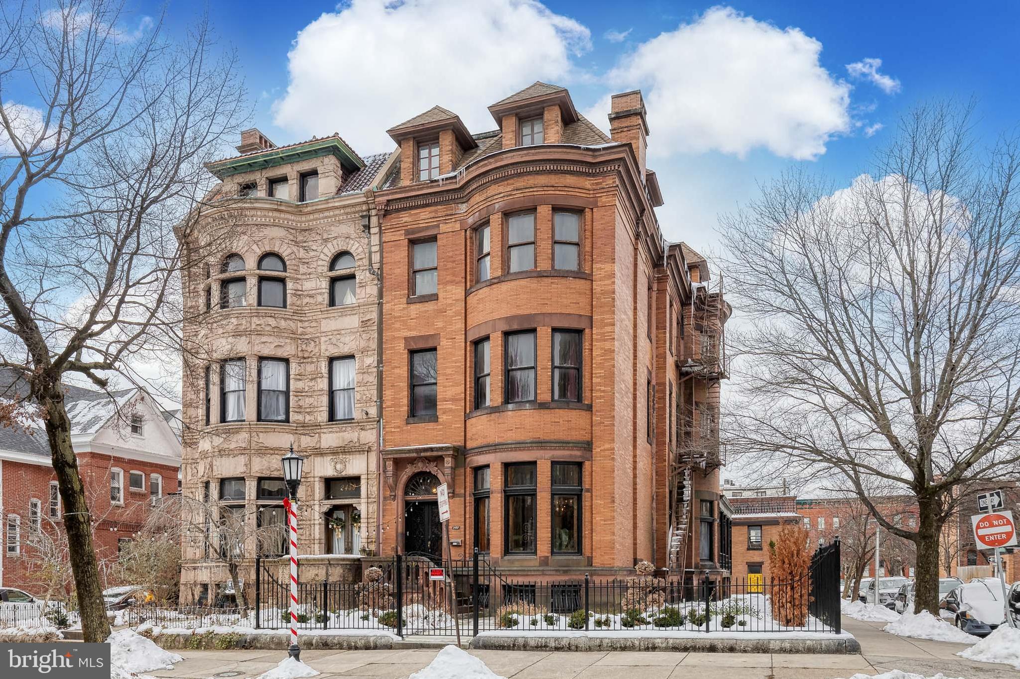 a front view of a building with a lot of windows