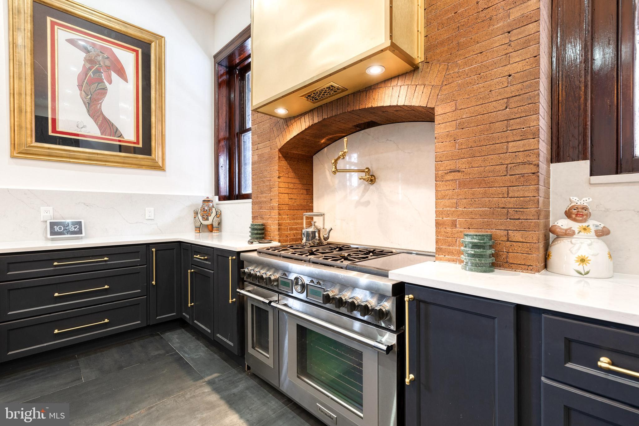 2452 Eutaw Place Baltimore, MD 21217 - Photo 24 of 75 a kitchen with a stove and a microwave
