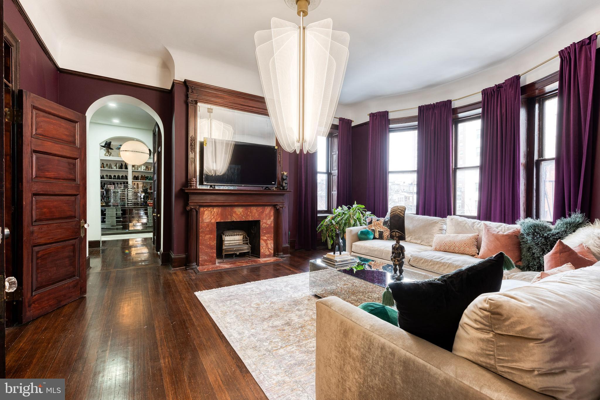 2452 Eutaw Place Baltimore, MD 21217 - Photo 34 of 75 a living room with furniture fireplace and flat screen tv