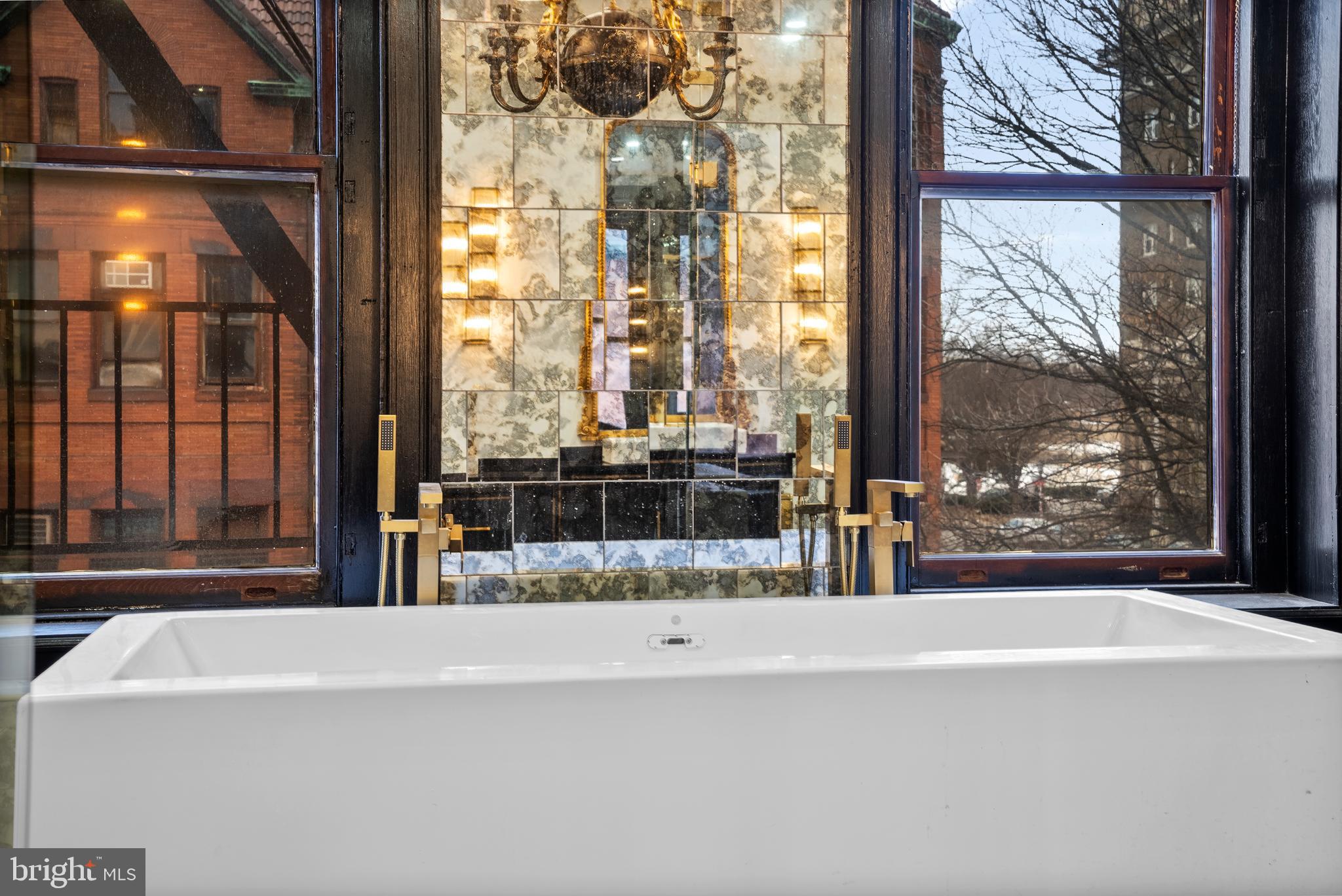 2452 Eutaw Place Baltimore, MD 21217 - Photo 42 of 75 a living room with a large window and doors