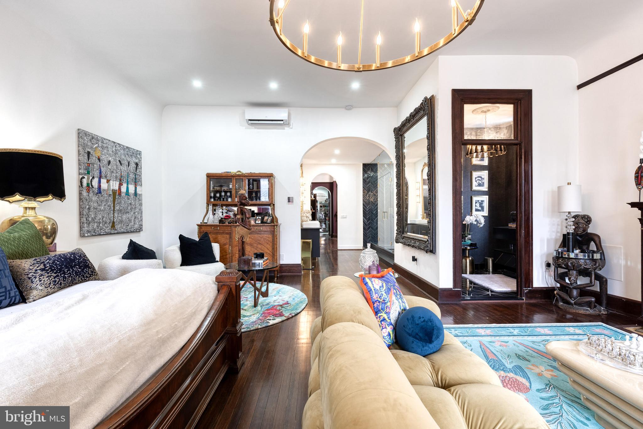 2452 Eutaw Place Baltimore, MD 21217 - Photo 53 of 75 a living room with furniture and a chandelier