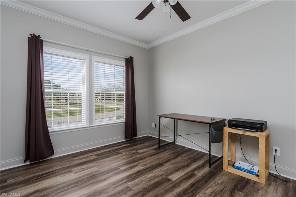 104 Rookery Road Naples, FL 34114 - Photo 16 of 32 a view of room with window and wooden floor