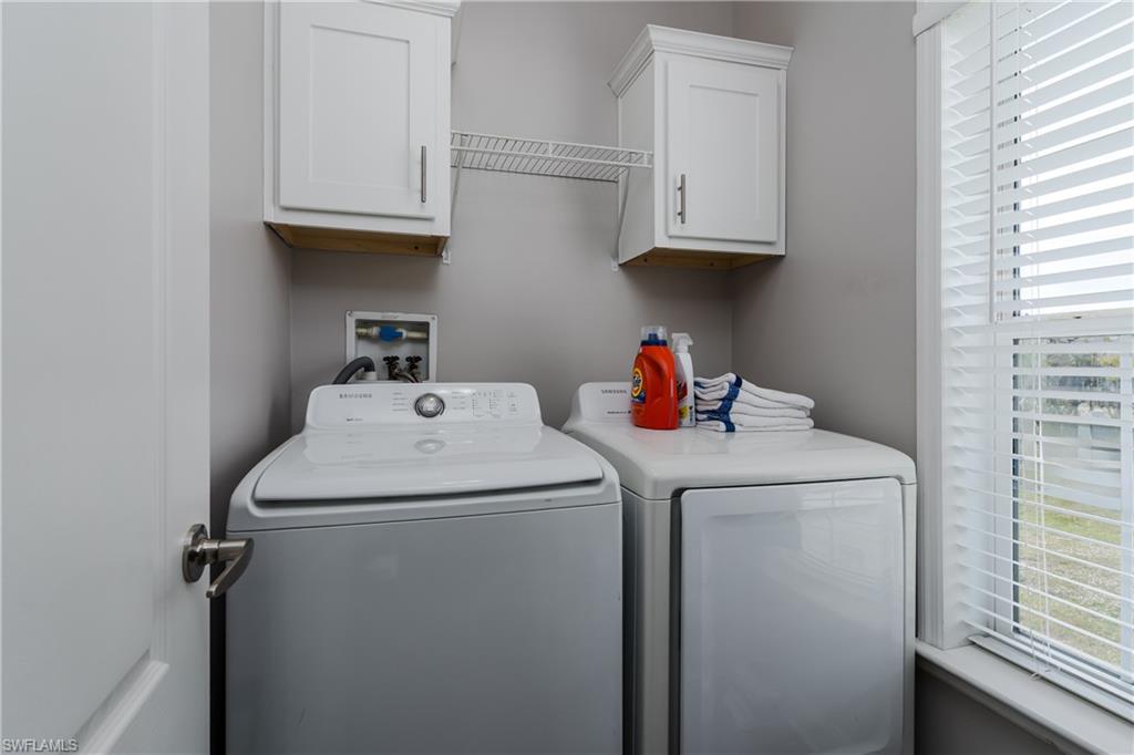 104 Rookery Road Naples, FL 34114 - Photo 20 of 32 a utility room with dryer and washer