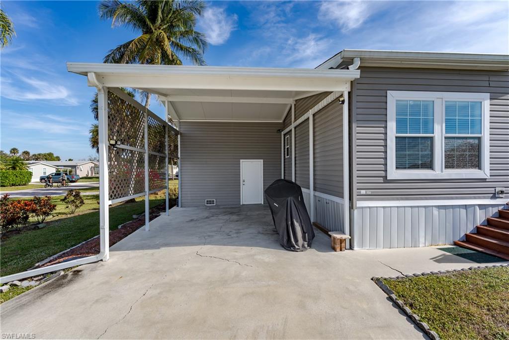 104 Rookery Road Naples, FL 34114 - Photo 21 of 32 a view of a house with backyard and porch