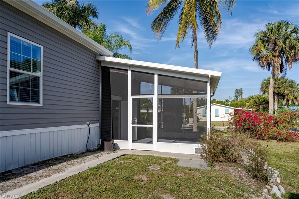 104 Rookery Road Naples, FL 34114 - Photo 25 of 32 a view of house with backyard and garden