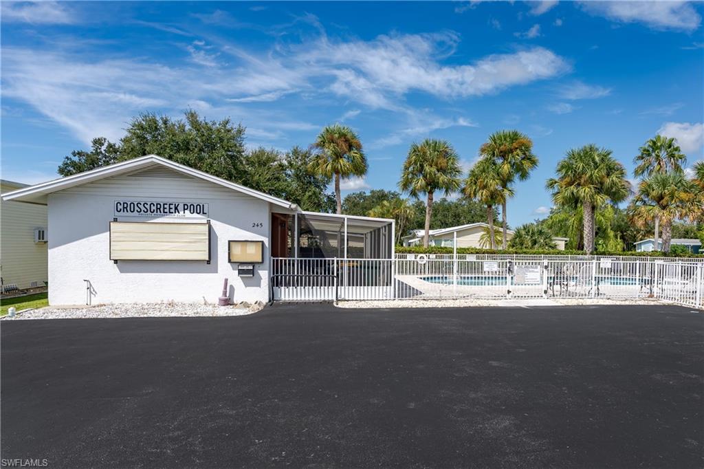104 Rookery Road Naples, FL 34114 - Photo 29 of 32 a view of a house with a yard
