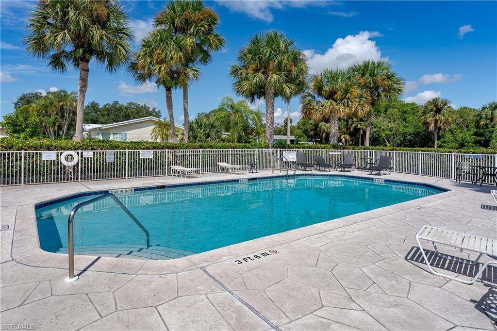 104 Rookery Road Naples, FL 34114 - Photo 31 of 32 a view of a swimming pool with a patio