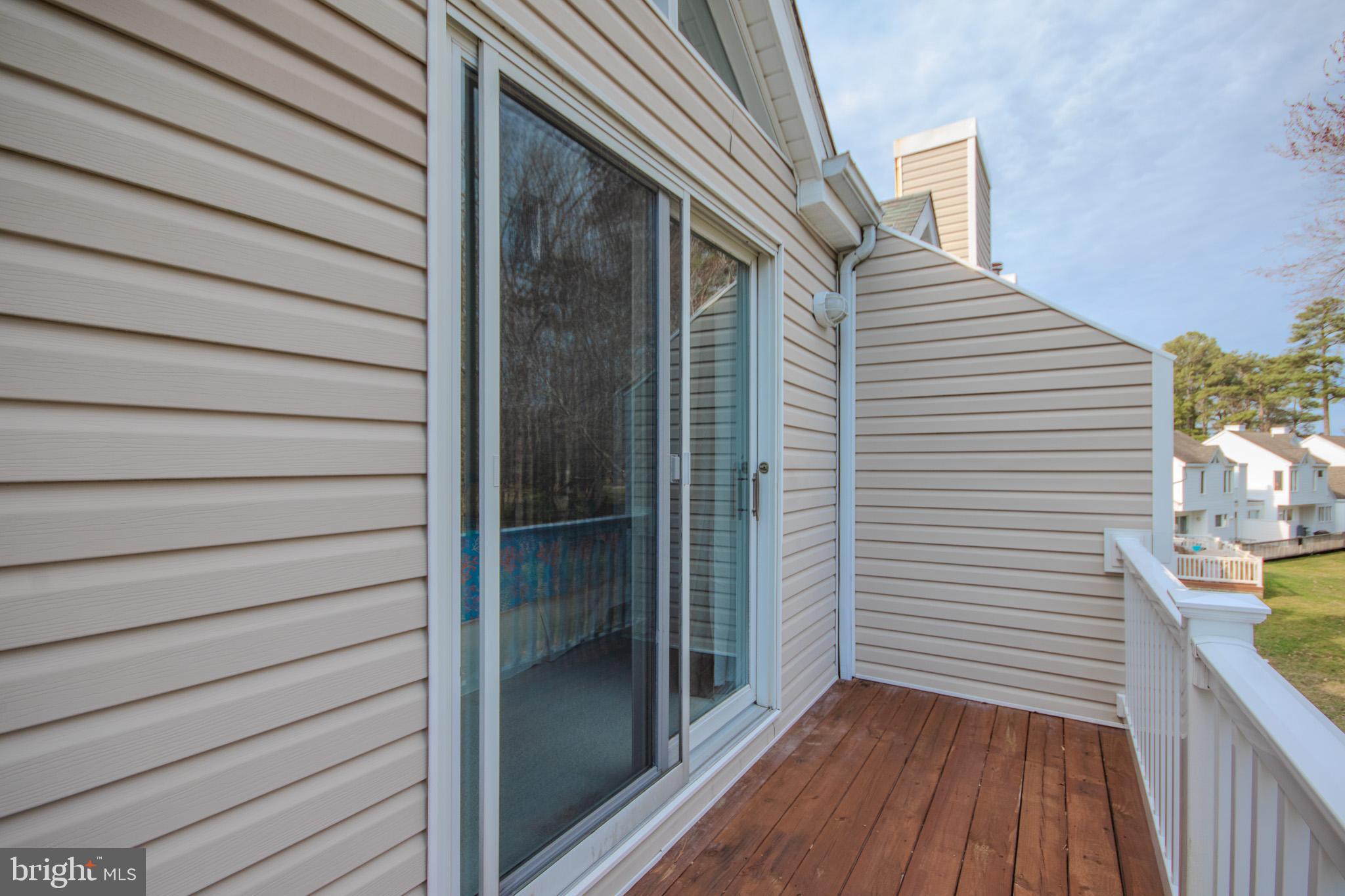 11610 Masters Lane, Unit 115 Berlin, MD 21811 - Photo 22 of 46 a view of a house with a balcony